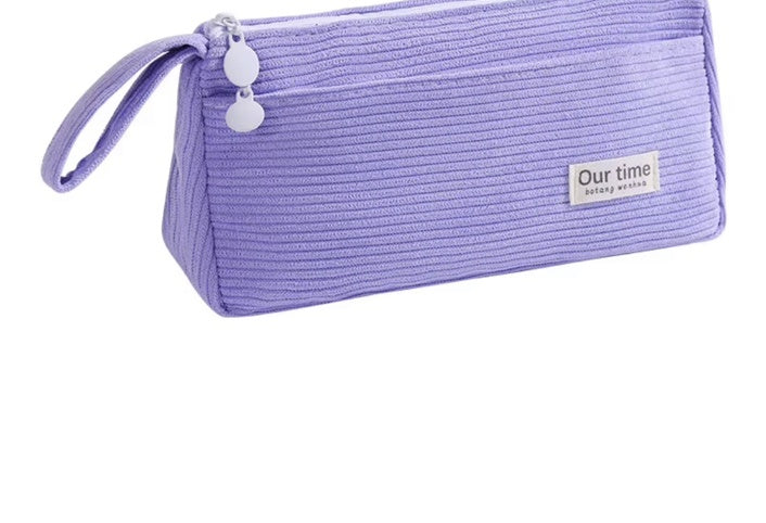 Purple corduroy pencil case on white background