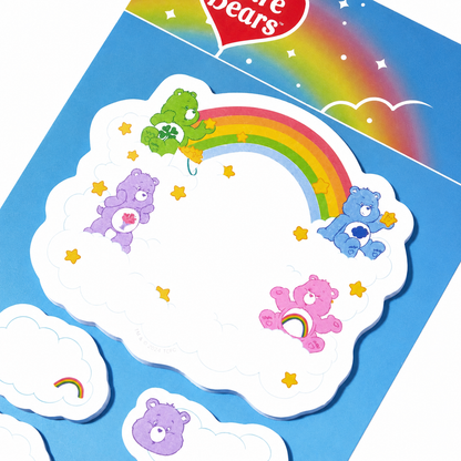 Close-up of Care Bears rainbow cloud sticky note design on a white background