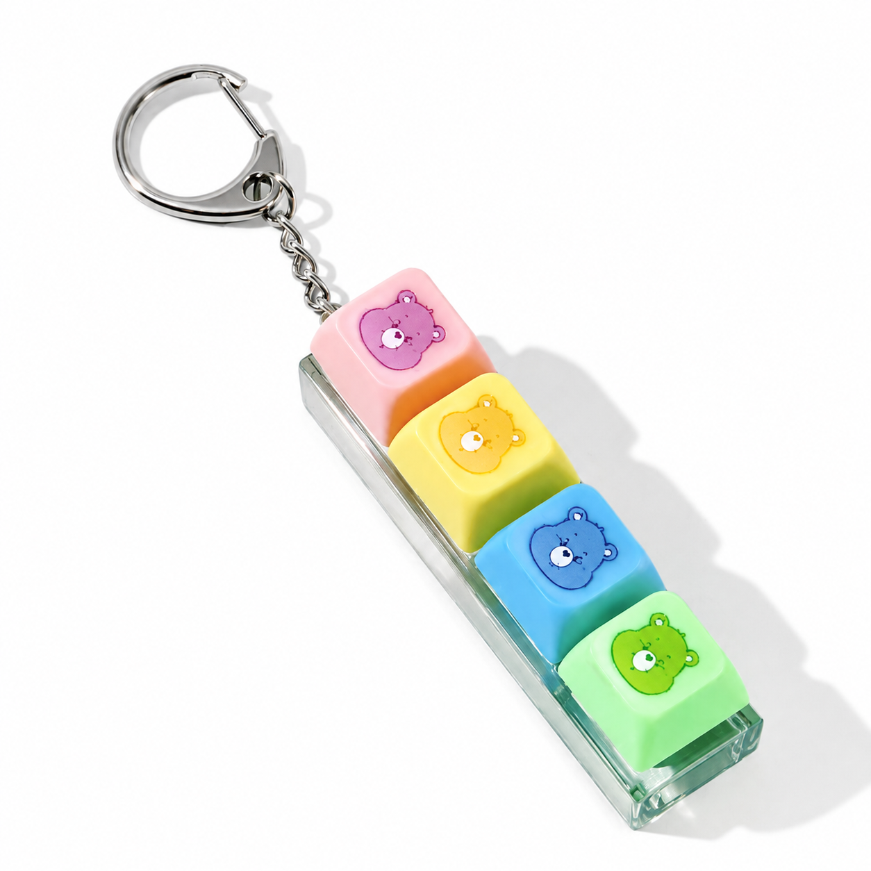 Flat-lay view of Care Bears four-button fidget keychain