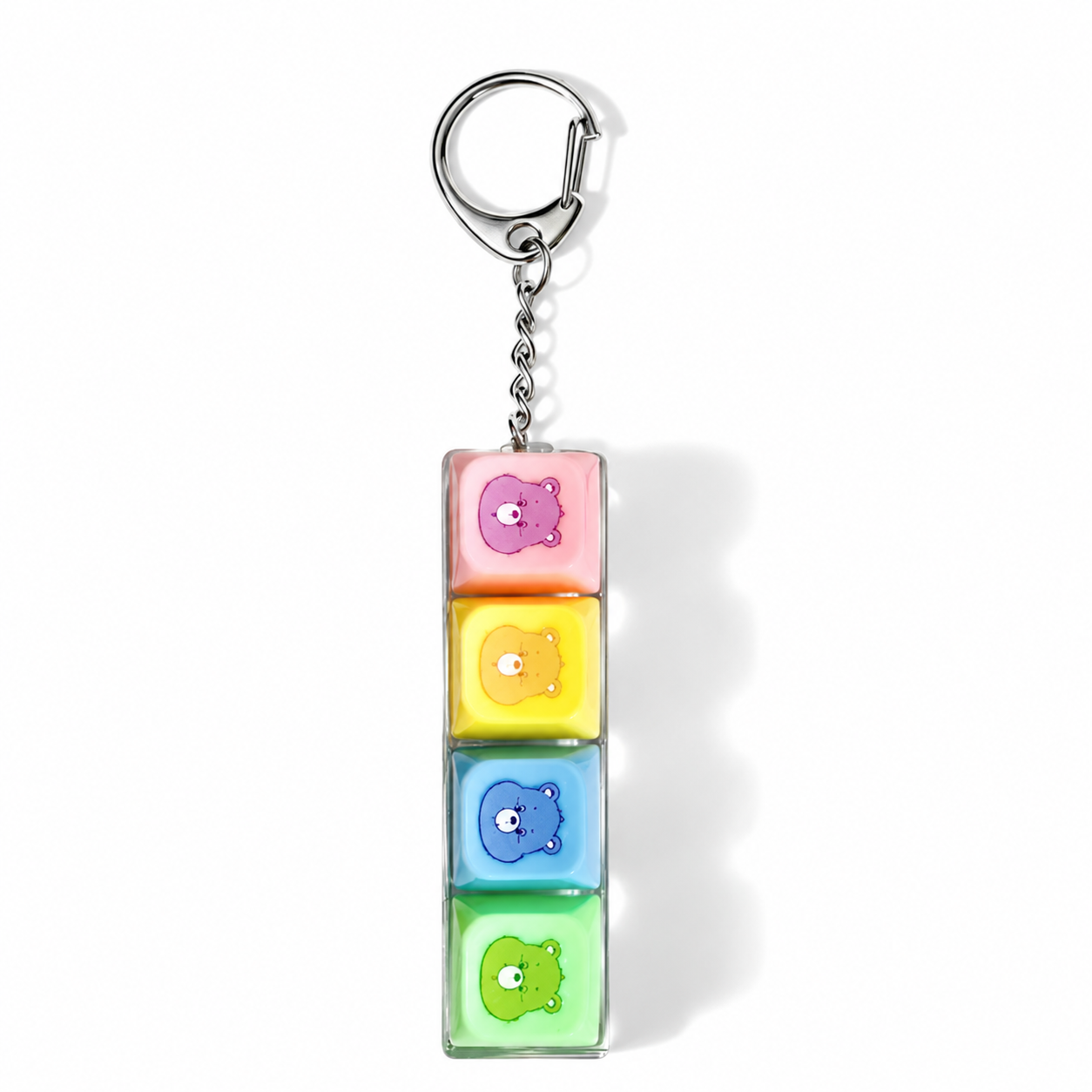 Care Bears four-button fidget keychain with pink, yellow, blue and green clickers