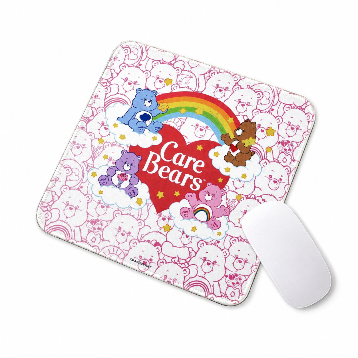 Care Bears pink rainbow mouse pad with white mouse on white background