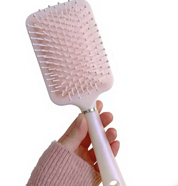 Pink pastel paddle hairbrush