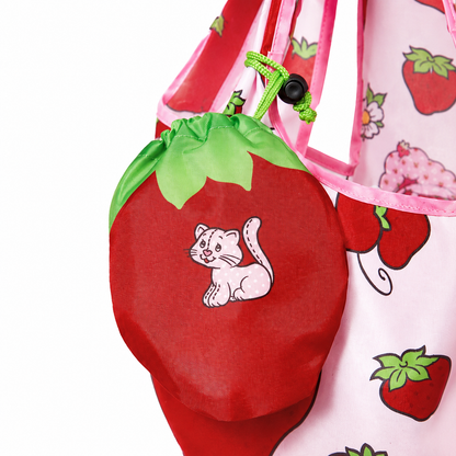 Strawberry-shaped storage pouch detail with Custard cat print